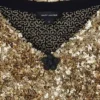 Abito in maglia con scollo a V e paillettes Abito in maglia con scollo a V e paillettes