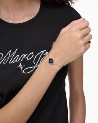 Il bracciale con catena a bottoni Il bracciale con catena a bottoni