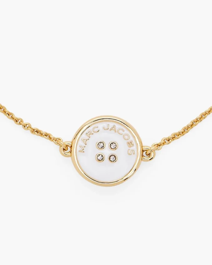 Il bracciale con catena a bottoni Il bracciale con catena a bottoni