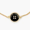 Il bracciale con catena a bottoni Il bracciale con catena a bottoni