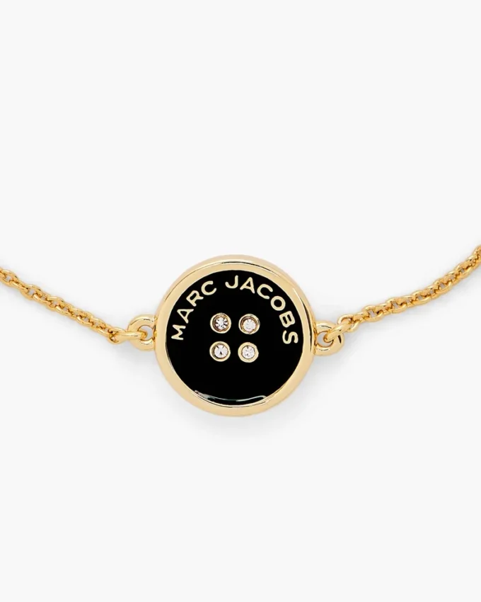 Il bracciale con catena a bottoni Il bracciale con catena a bottoni