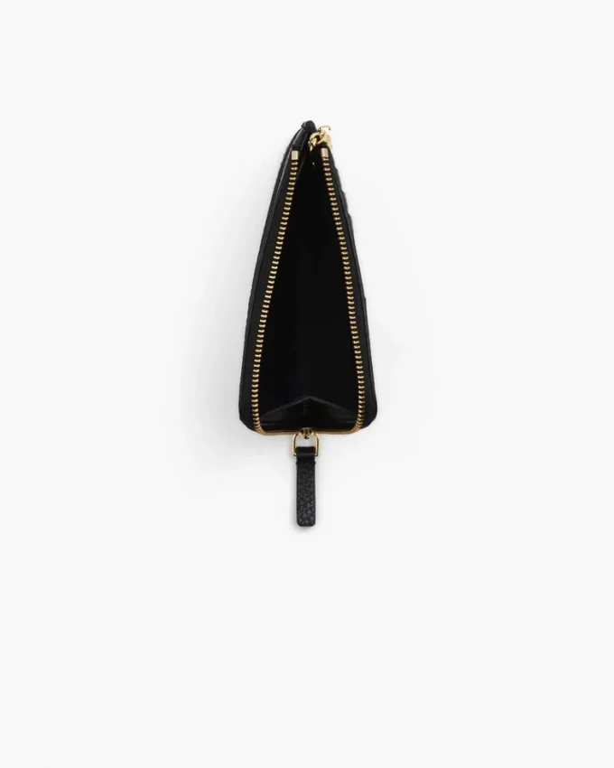 Il portafoglio multiuso in pelle con chiusura superiore a zip Il portafoglio multiuso in pelle con chiusura superiore a zip