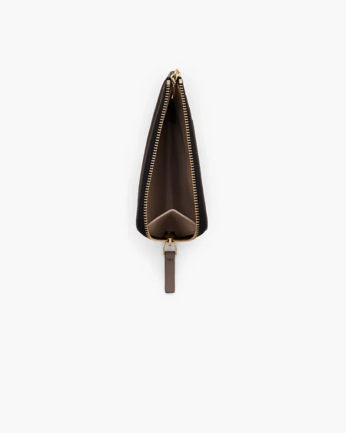Il portafoglio multiuso in pelle con chiusura superiore a zip Il portafoglio multiuso in pelle con chiusura superiore a zip