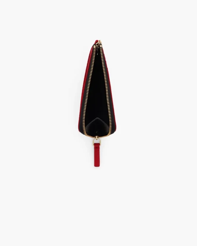 Il portafoglio multiuso in pelle con chiusura superiore a zip Il portafoglio multiuso in pelle con chiusura superiore a zip