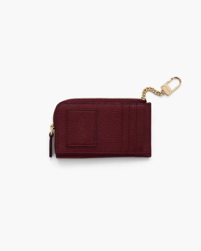 Il portafoglio multiuso in pelle con chiusura superiore a zip Il portafoglio multiuso in pelle con chiusura superiore a zip