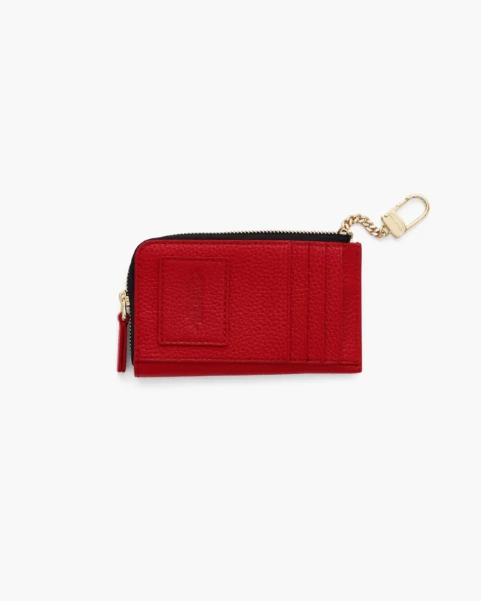 Il portafoglio multiuso in pelle con chiusura superiore a zip Il portafoglio multiuso in pelle con chiusura superiore a zip
