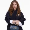La mini borsa doppia in denim con ciondoli La mini borsa doppia in denim con ciondoli