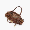 La piccola borsa Cristina in pelle scamosciata La piccola borsa Cristina in pelle scamosciata