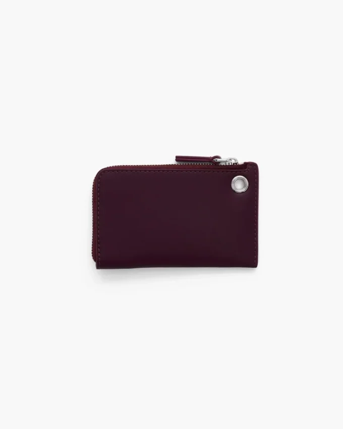 Portafoglio con chiusura superiore e charm Portafoglio con chiusura superiore e charm
