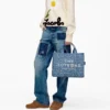 The Joy Denim Medium Tote Bag The Joy Denim Medium Tote Bag