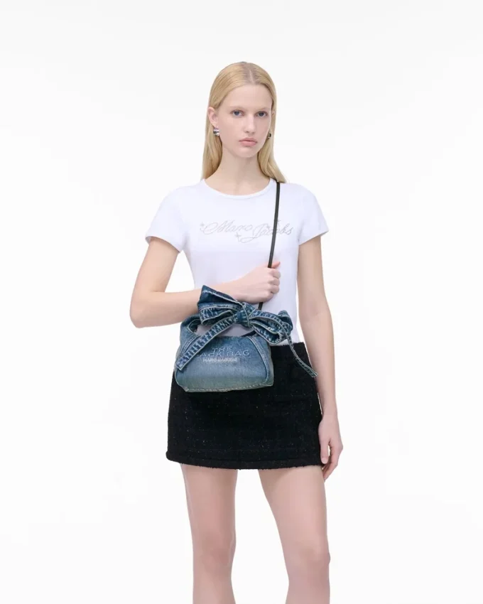 The Sack Bag mini in denim with a bow