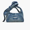 The Sack Bag mini in denim with a bow