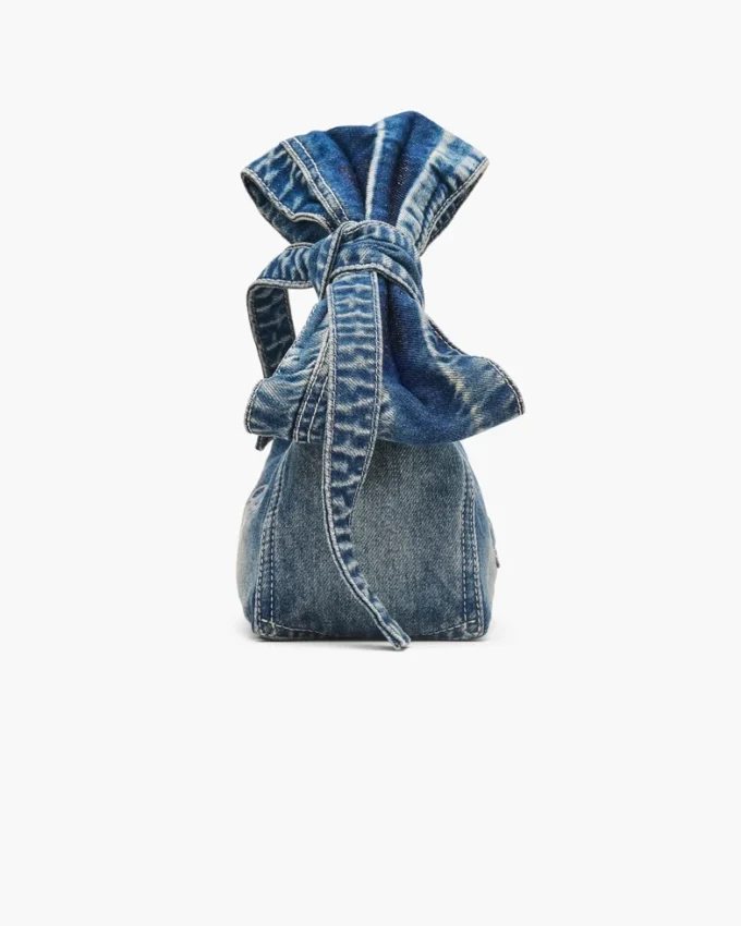 The Sack Bag mini in denim with a bow