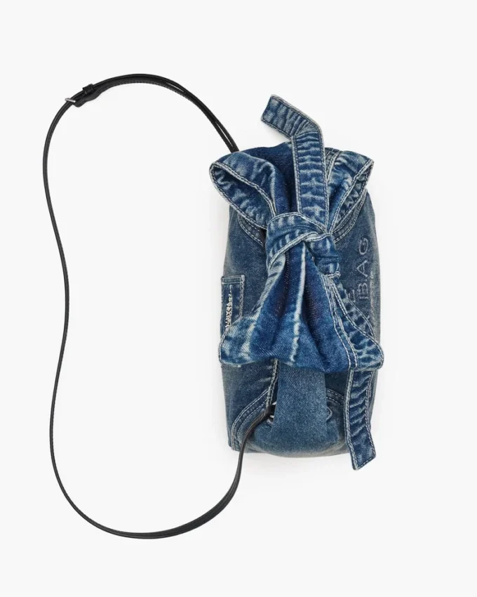 The Sack Bag mini in denim with a bow