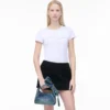 The Sack Bag mini in denim with a bow